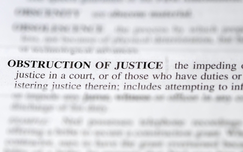 close up photo of the words obstruction of justice